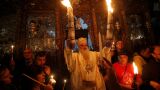 Чудото, което се случва всяка година: Историята на Благодатния огън (СНИМКИ)